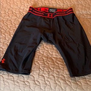 Men’s long UA compression shorts